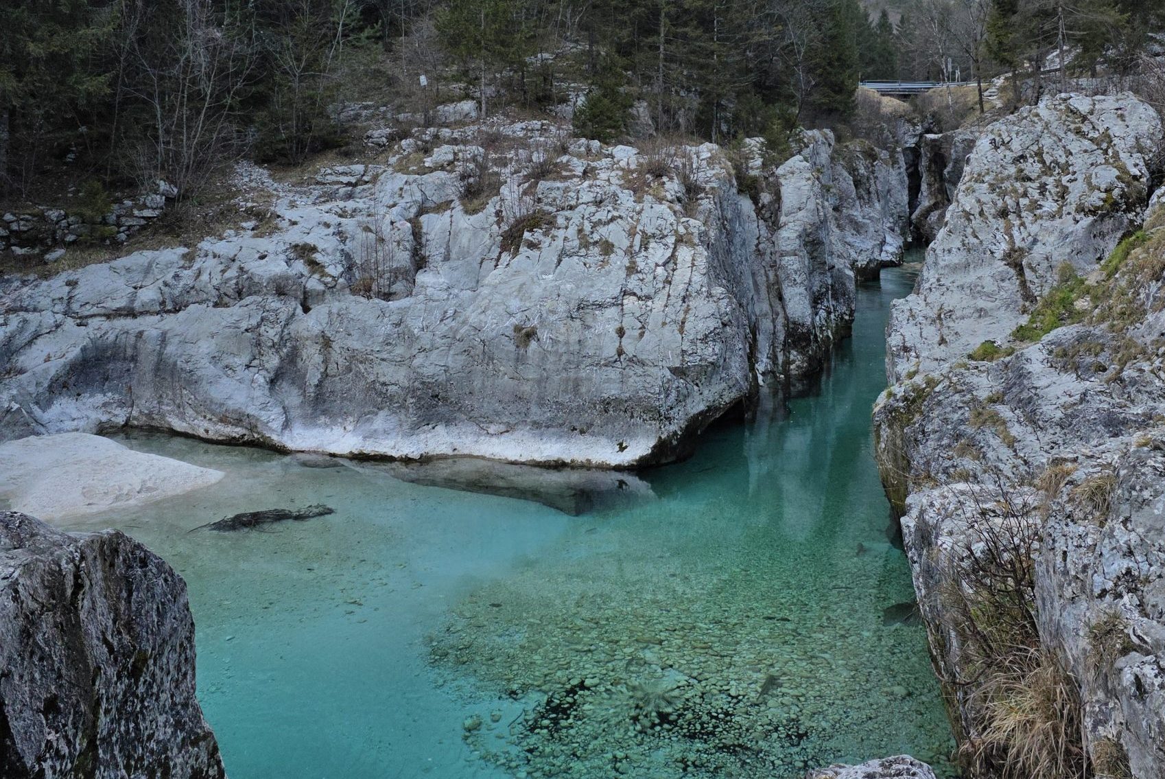 Clear turquoise water among rocky cliffs